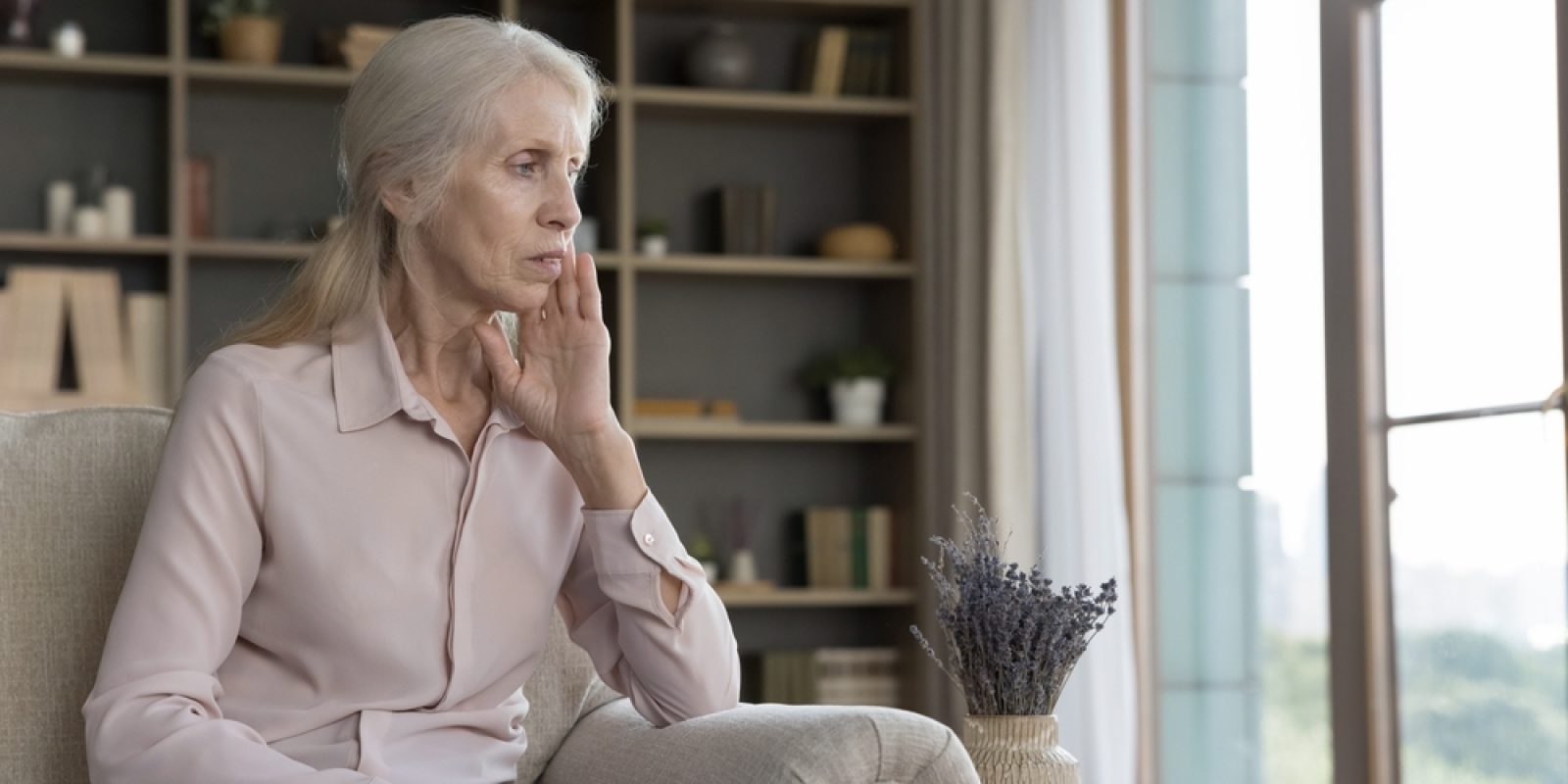 Depressed,Lonely,Senior,Grey,Haired,Woman,Sitting,On,Home,Couch,